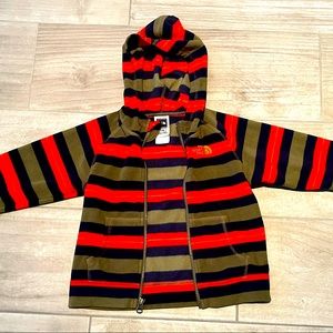 The North Face fleece zip up sweater with cute red/orange and brown striped